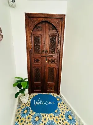 a door with a welcome mat in front of it at Maison Berber in Ourika