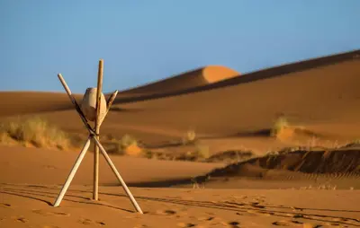 a stick in the sand in a desert at bed&breakfast in Merzouga