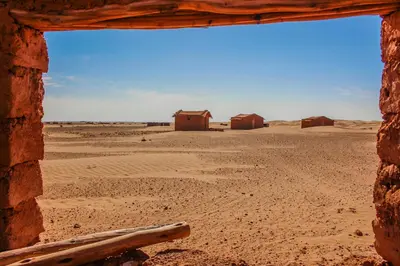 a view of the desert from a window in a building at bed&breakfast in Merzouga