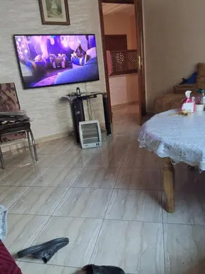a living room with a flat screen tv on the wall at Jungle au centre de Marrakech avec Jacuzzi ! Partager EnregistrerJungle au centre de Marrakech avec Jacuzzi ! Partager Enregistrer in Fès