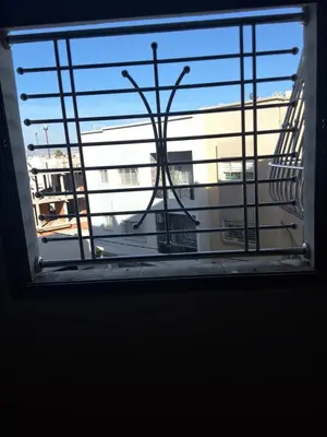 a window with a view of a building at Jungle au centre de Marrakech avec Jacuzzi ! Partager EnregistrerJungle au centre de Marrakech avec Jacuzzi ! Partager Enregistrer in Fès