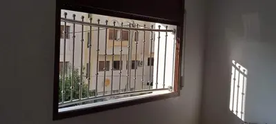 a window with a view of a building at Jungle au centre de Marrakech avec Jacuzzi ! Partager EnregistrerJungle au centre de Marrakech avec Jacuzzi ! Partager Enregistrer in Fès