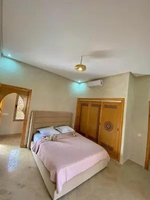 a bedroom with a large bed in a room at Villa Bellevue in Sbiti