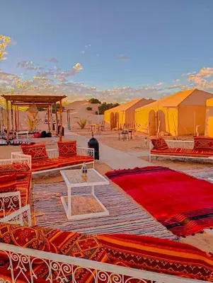 a group of tents in the middle of the desert at Tenere desert luxury camp in Merzouga