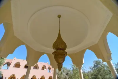a chandelier hanging from the ceiling of a building at Jnane az Zatr Villa and pool Ourika in Ourika