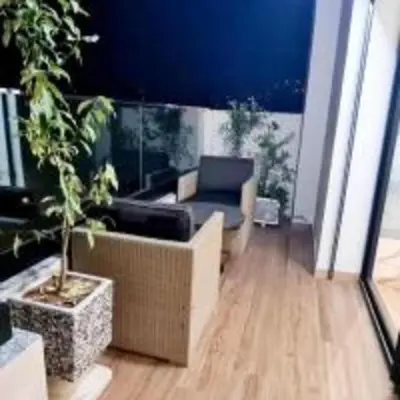 a living room with a couch and a chair at Lusail in Beni Mellal