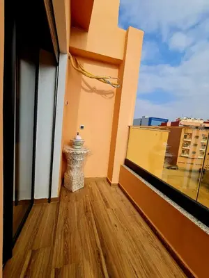 a balcony with a view of a building at Lusail in Beni Mellal