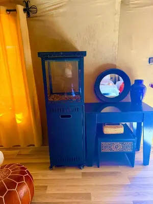 a blue cabinet with a fish tank on a table at Amrad luxury camp in Merzouga