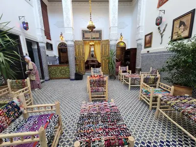 a church with rows of chairs and tables in a room at Dar Zerbtana suite Kenza in Fès