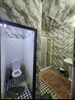 a bathroom with a toilet and a sink at Dar Zerbtana suite Kenza in Fès