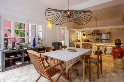 a kitchen and dining room with a table and chairs at Charming 5 bedroom in Marrakech