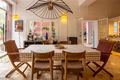 a dining room with a table and chairs at Charming 5 bedroom in Marrakech