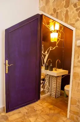 a large purple door in a bathroom with a sink at Charming 5 bedroom in Marrakech