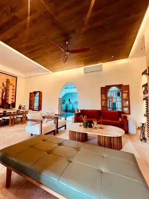 a living room with a couch and a table at Villa Dar Al Hayat in Marrakech