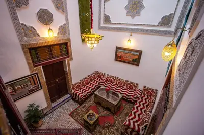 an overhead view of a living room with a table and chairs at Dar Bab jdid fez in Fès