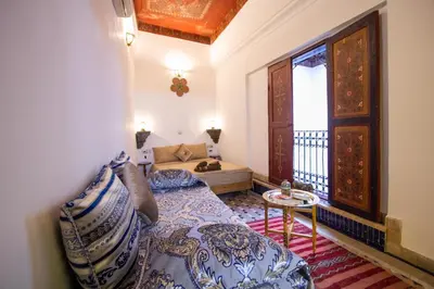 a small room with a bed and a window at Dar Bab jdid fez in Fès
