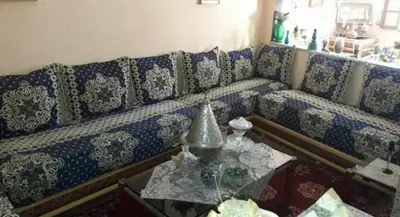 a living room with a couch and a table at Maison in Nzala Beni Ammar