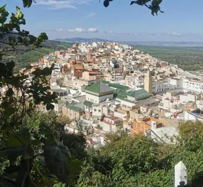 a view of a city from a hill at Maison in Nzala Beni Ammar