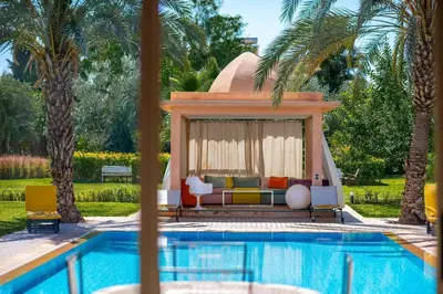 a villa with a swimming pool and a gazebo at Villa Lumina in Marrakech