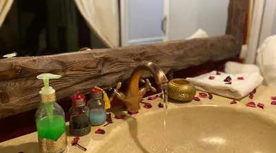 a bathroom sink with a sink at Desert Night Luxury Camp in Merzouga