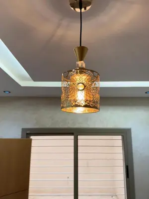 a chandelier hanging from a ceiling over a garage door at Fes shore listings in Fès