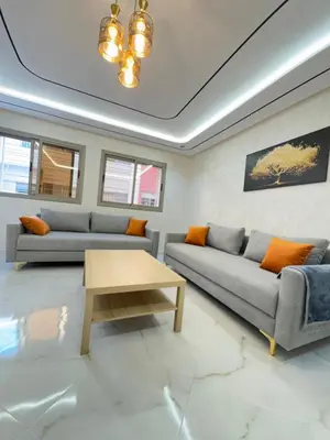 a living room with two couches and a coffee table at Fes shore listings in Fès