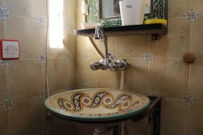 a bathroom with a sink with a faucet at Gîte rural à Jnane Imass in Jnane Imes