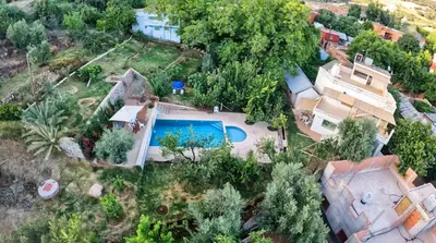 an aerial view of a house with a swimming pool at Gîte rural à Jnane Imass in Jnane Imes