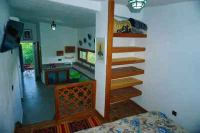 a room with a staircase leading to a bedroom at Gîte rural à Jnane Imass in Jnane Imes