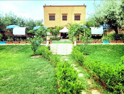 a garden with a building in the background at Pool villa in Ourika in Ourika