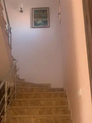 a staircase in a house with a picture on the wall at Pool villa in Ourika in Ourika
