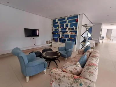 a living room with a couch and two chairs and a table at Villa Michel Lucas in Marrakech