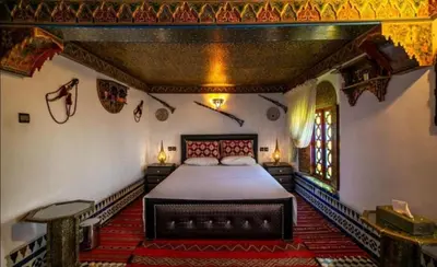 a bedroom with a large bed in a room at Dar Fez Mayssae in Fès