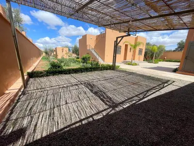 a view of a building with a metal roof at Villa Ghaith in Douar Tounsi