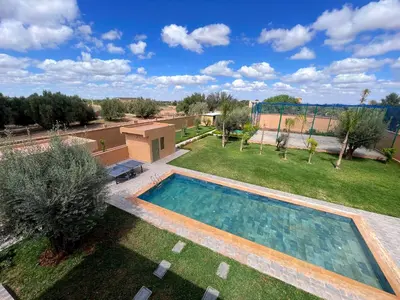 an overhead view of a backyard with a swimming pool at Villa Ghaith in Douar Tounsi