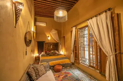 a bedroom with a bed and a large window at Fez Valley Luxury Camp in Fès