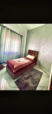 a bedroom with a bed in a room at Alia in Fès