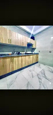 a kitchen with a marble counter top and a stove at Alia in Fès