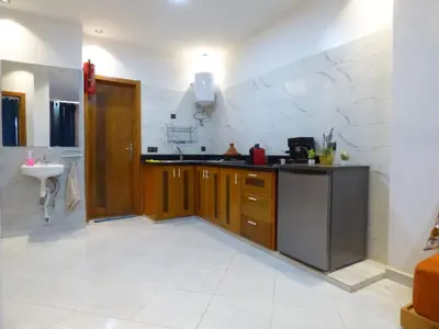 a kitchen with a counter and a sink in it at Diyafat Ghandi in Khenifra
