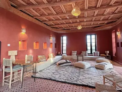 a living room with a couch and a table at Lunaluxurycamp in Merzouga