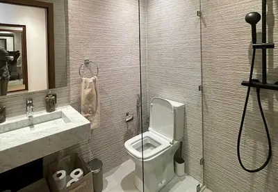 a bathroom with a toilet and a sink and a shower at Villa youssef in Oulad Tayeb