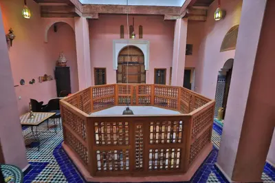 a church with a wooden altar in a room at Dar Nana fes in Fès