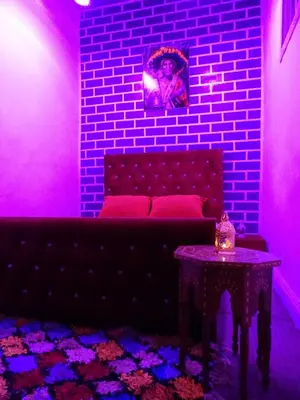 a living room with a couch and a table at el habib in Fès