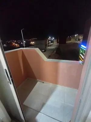 a view of a balcony at night at Maison d'hôte Najah 2 in Khenifra