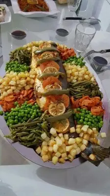 a plate full of different types of food on a table at Merzougadreamcamp in Merzouga