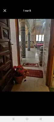 a hallway of a building with a door and a room at FeS in Fès