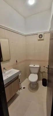 a bathroom with a toilet and a sink at Appartement de charme in Fès