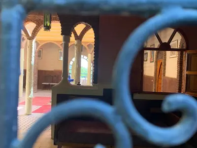 a view of a room with arches and a window at Riad Belgika Marrakech in Ourika