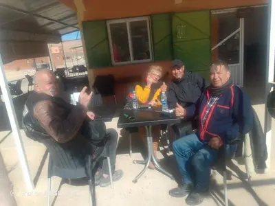 a group of people sitting at a table at Ait hani in Tinerhir