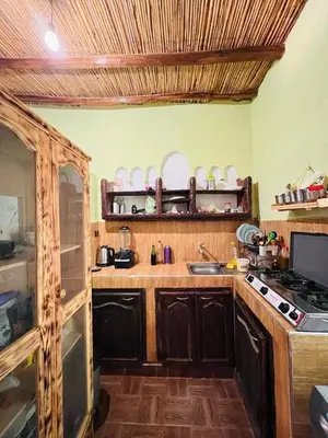 a kitchen with a sink and a stove top oven at Merzouga camp activités in Merzouga